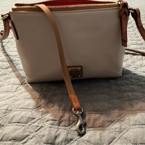 Dooney & Bourke small leather purse. Excellent used condition, beige & tan.